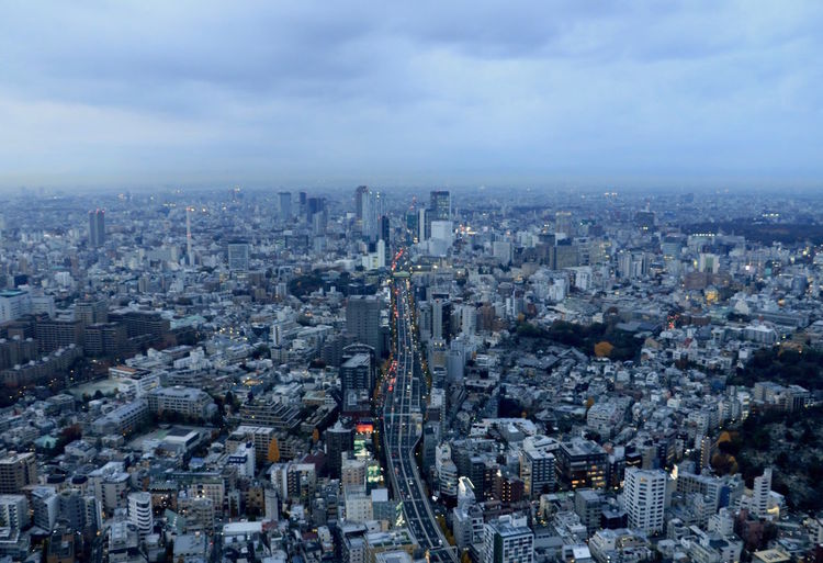 High angle view of modern buildings in city against sky