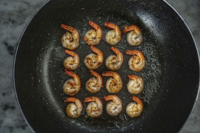 Directly above shot of prawns frying in pan