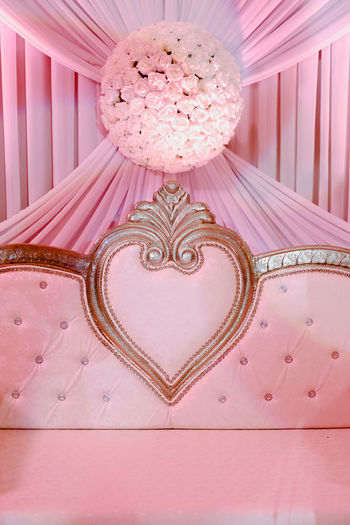 Directly below shot of heart shape on pink table
