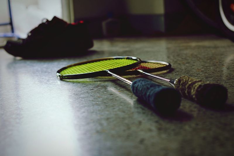 Badminton rackets on floor at home