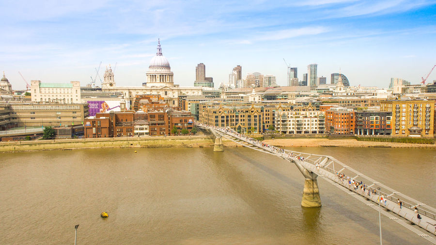 High angle view of millennium bridge over thames river in city