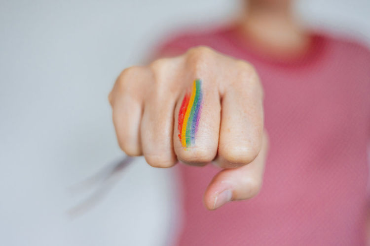Fist painted with the rainbow flag lgbtq