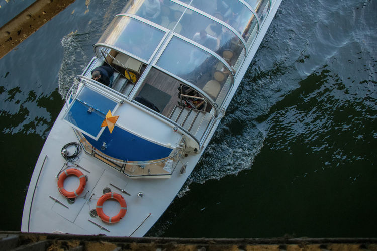 High angle view of a tourist boat going through the canal