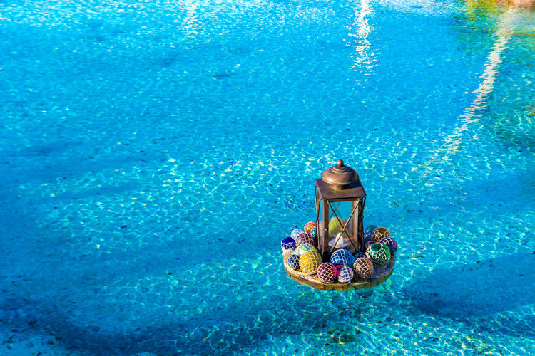 High angle view of decorations floating on swimming pool