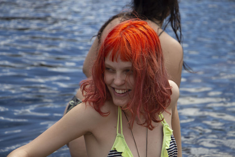 Girl smiling while swimming 