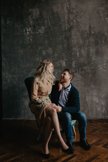 Beautiful couple, blonde girl and man with beard kissing, smiling