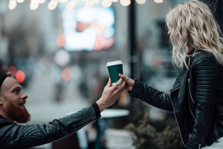 Side view of man using mobile phone