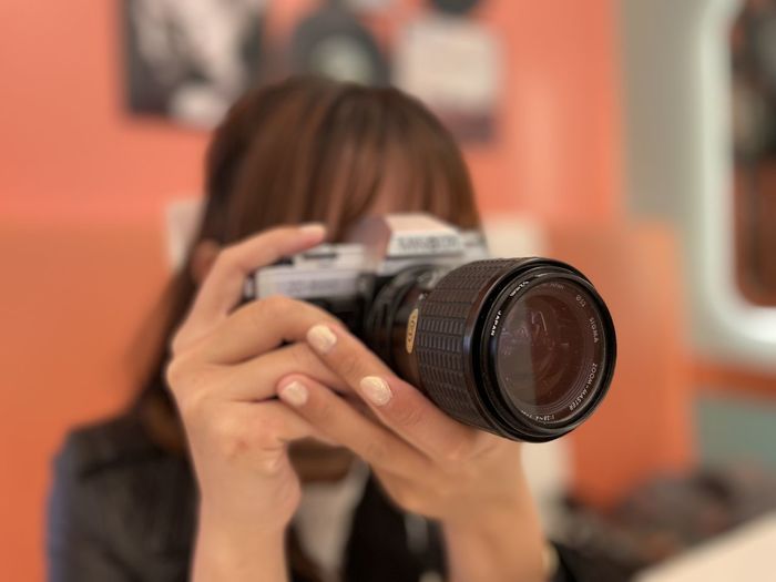 Woman photographing through camera