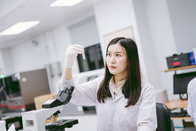 Scientist holding test tube at laboratory