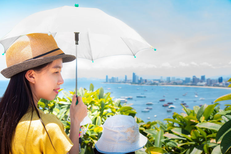 Man holding hat in water