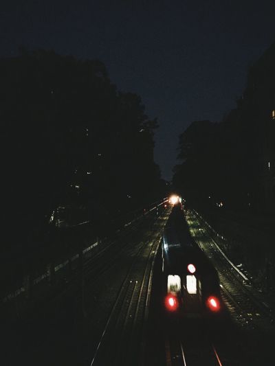 High angle view of train on railroad track at night