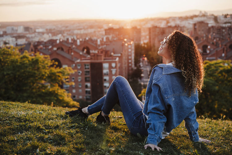 Young woman spending leisure time in park