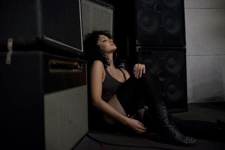 Young woman relaxing in a music studio