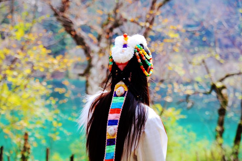 Rear view of woman wearing traditional headdress