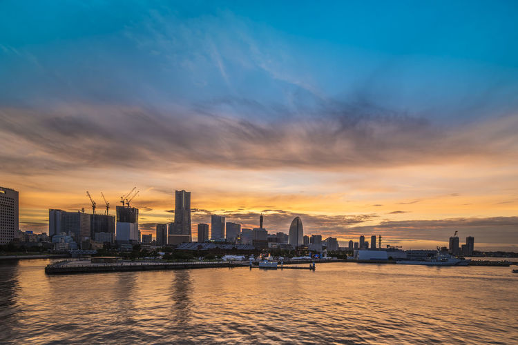 Panorama from osanbashi pier port of the landmark tower illuminated by the sunset sky of yokohama.