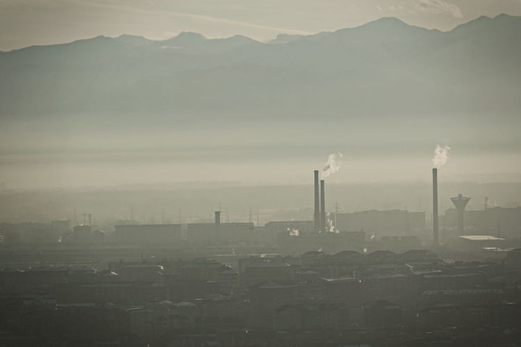 City skyline covered in a dense smog and pollution