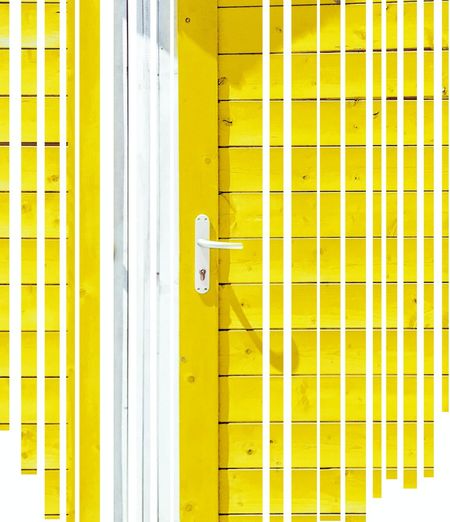 Close-up of yellow door of building