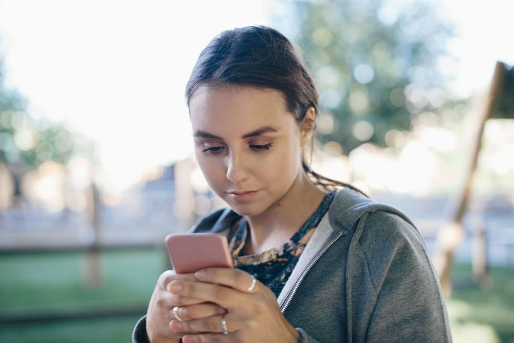 Young woman using smart phone