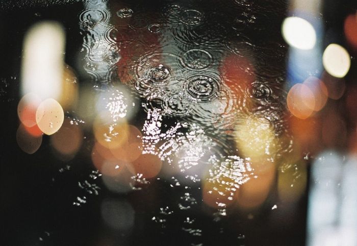 CLOSE-UP OF WATER DROPS ON GLASS