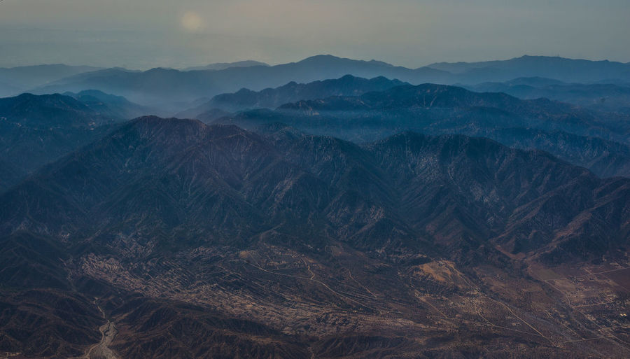 Scenic view of mountains range against sky