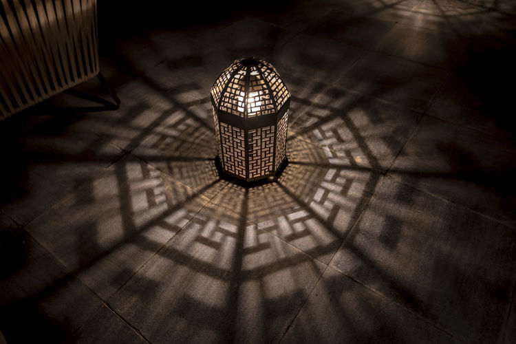 High angle view of illuminated lamp on tiled floor