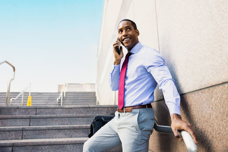 Portrait of young man using mobile phone