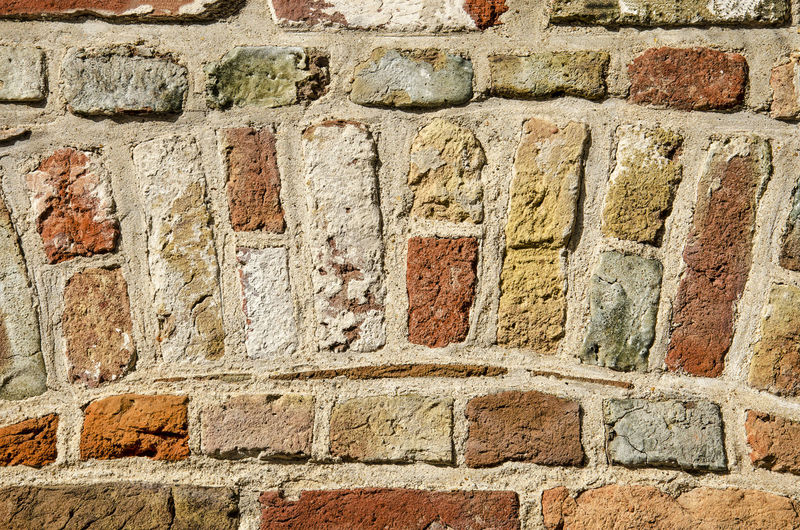 Full frame shot of colorful old brick wall