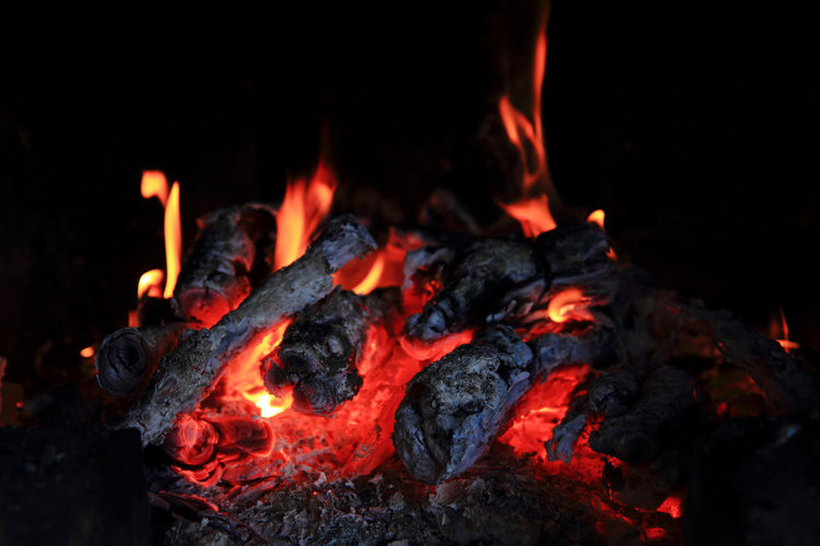 Close-up of fire burning at night