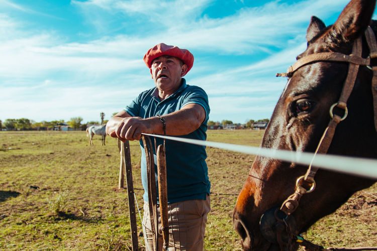 Portrait of farmer and his horse