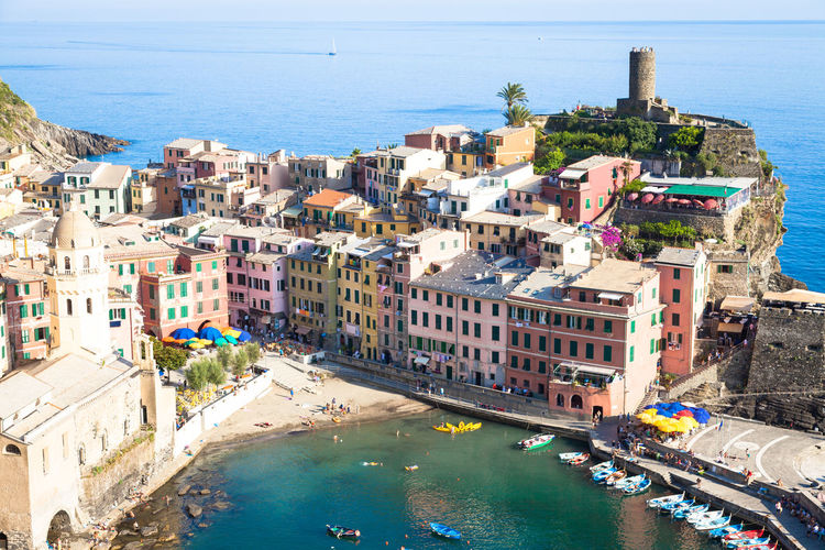 High angle view of cinque terr by amidst sea at vernazza