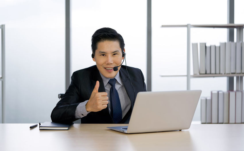 Portrait of mature man using laptop
