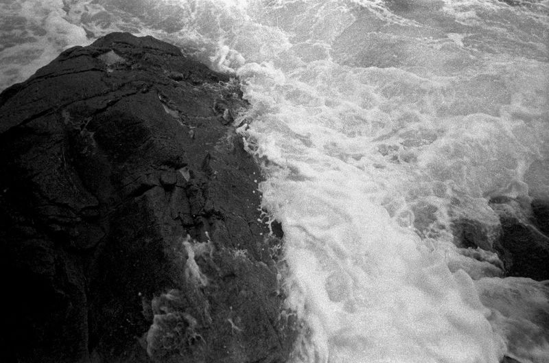 Close-up of water flowing through rocks