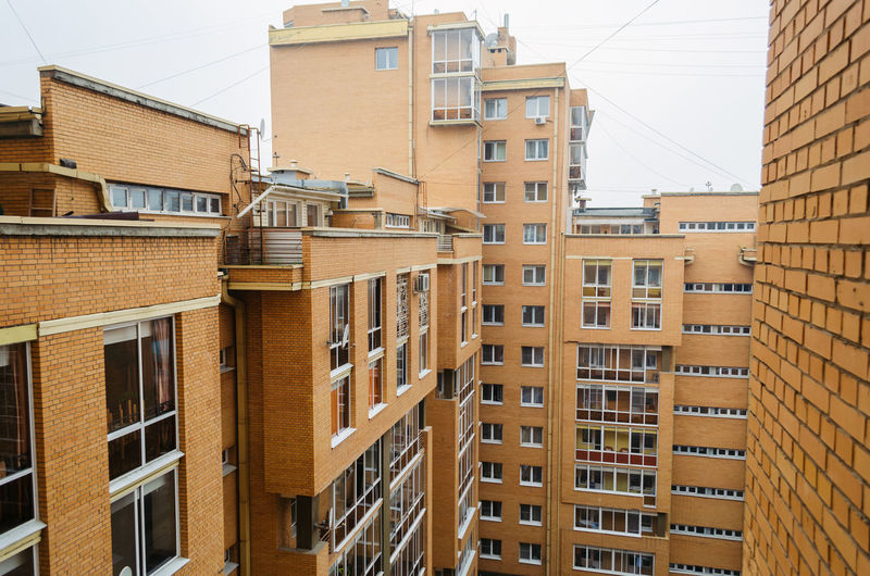 Multi-storey residential brick building, view from the window