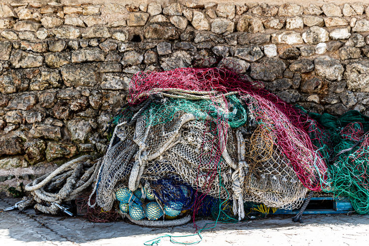 Close-up of fishing net on wall