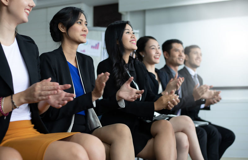 Business people applauding during presentation
