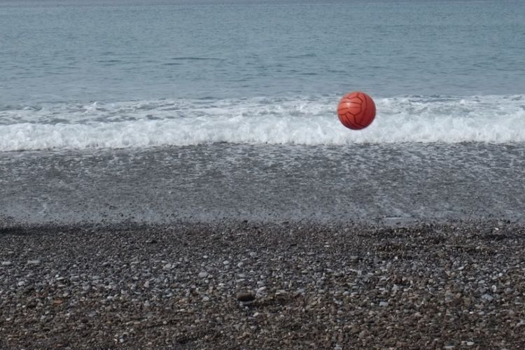 Red ball in sea
