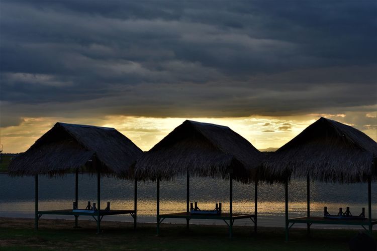 Scenic view of beach against sky during sunset