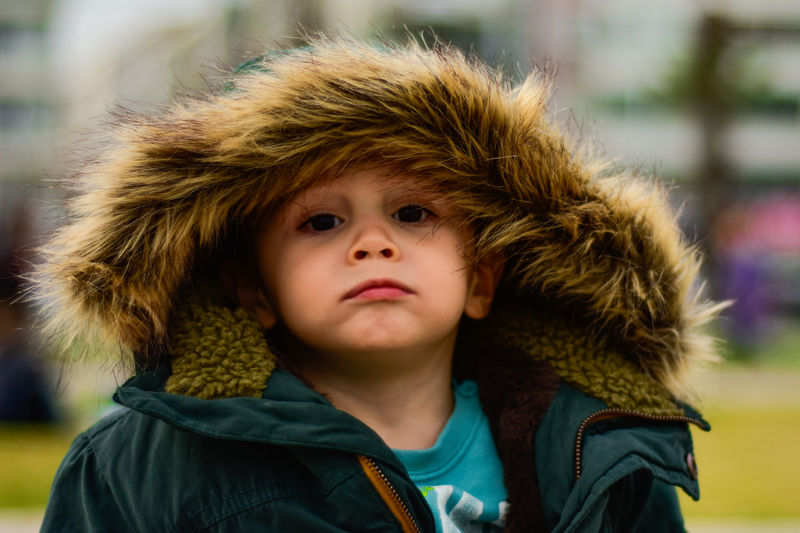 Close-up portrait of boy wearing warm clothing
