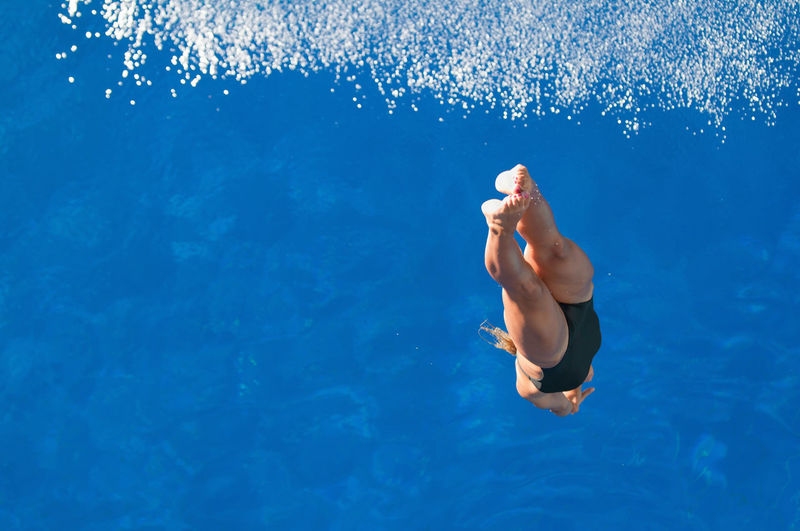 Mid adult woman swimming in pool