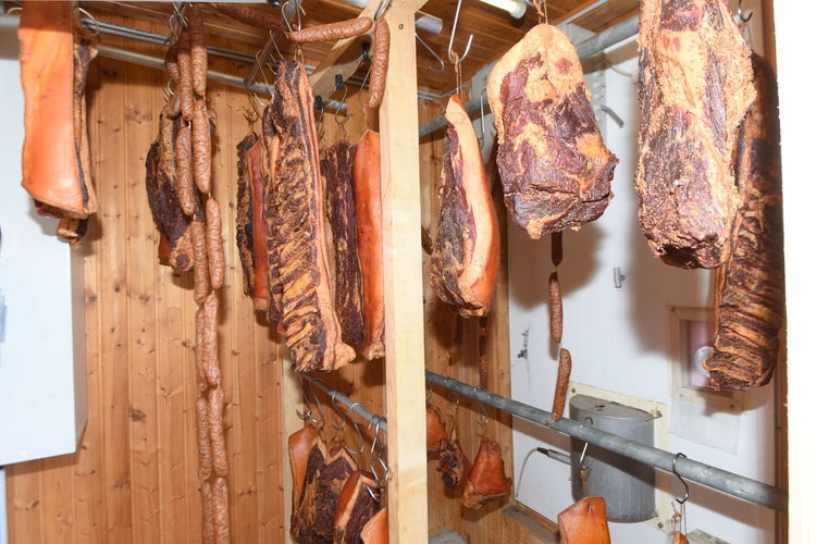 Ham in a smoking chamber, the process of refining meat