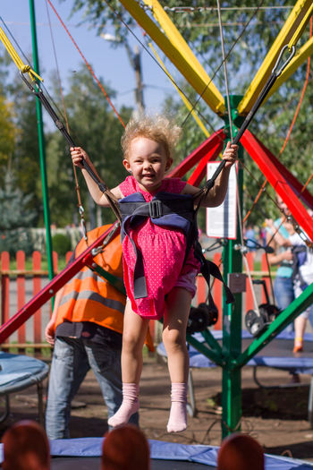 Full length of a smiling girl in playground