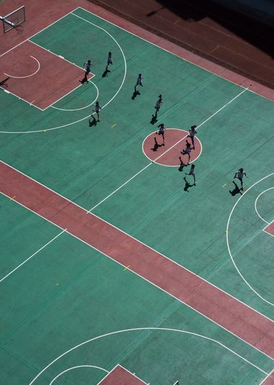 High angle view of people playing basketball court