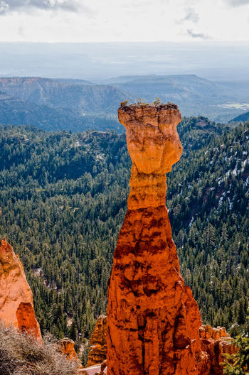 High angle view of tall rock formation overlooking landscape