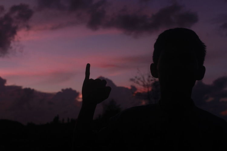 Portrait of silhouette man against sky during sunset
