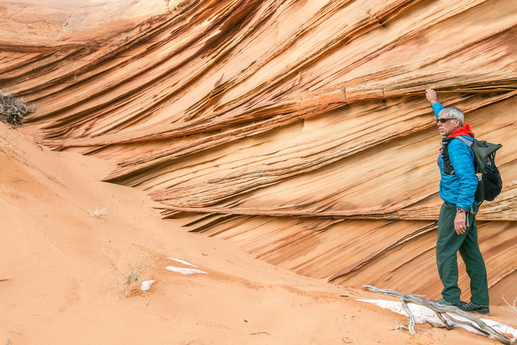 Man and lace rock in south coyote buttes, vermilion cliffs