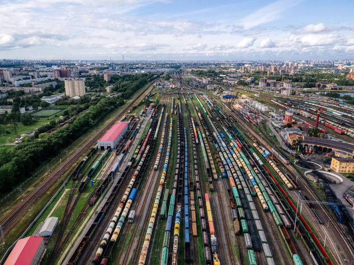 Aerial photo of railway terminal. freight wagons with goods on railroad station. cargo transport