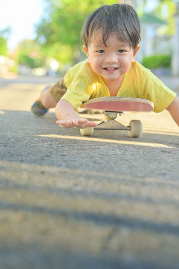 Portrait of cute boy playing outdoors