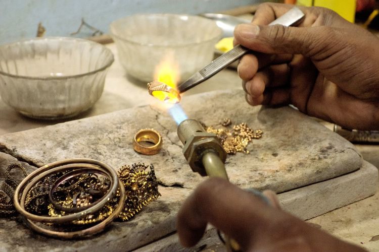 Goldsmith working with a unfinished ring