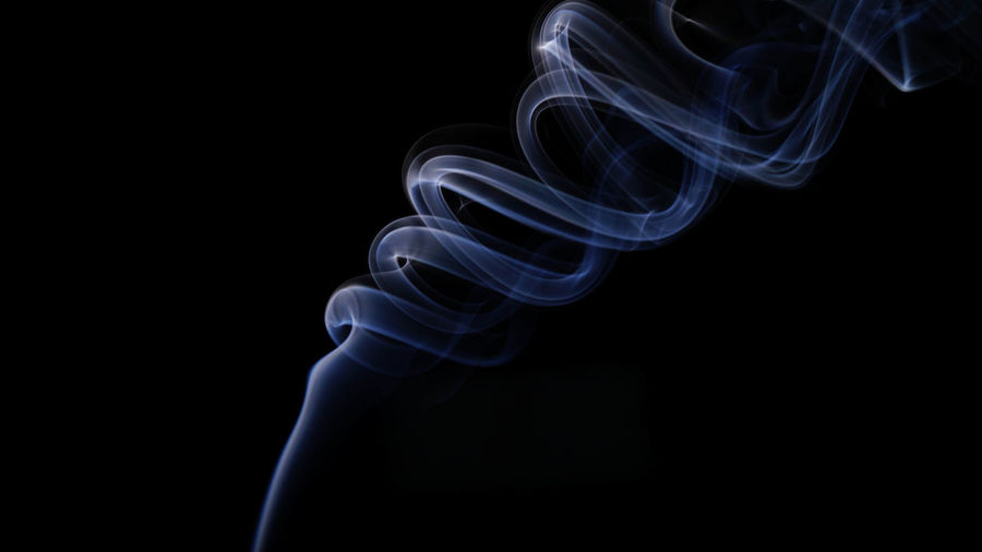 Abstract image of smoke against black background