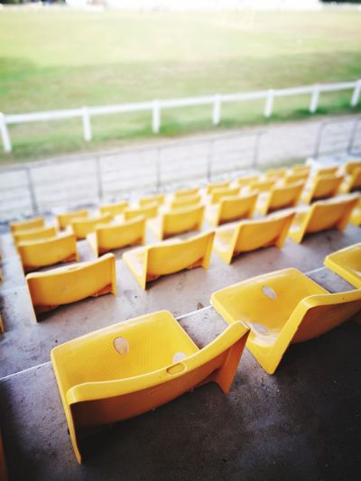 High angle view of yellow bleachers at stadium